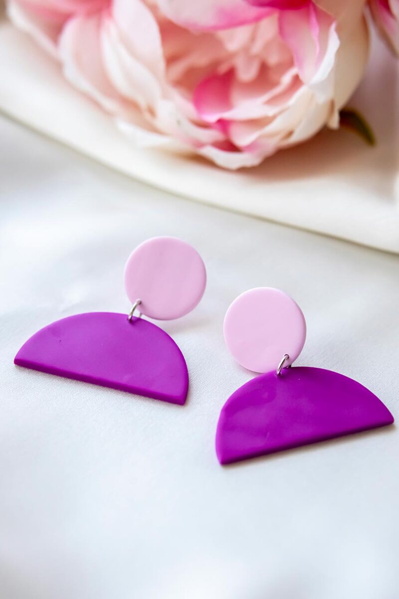 SmcEvoy_FuchsiaSemiCircleDangles_R Handcrafted statement necklace by Sarah McEvoy, featuring bold colours and mixed materials like fused glass and polymer clay, inspired by art and made in her Kildare studio.